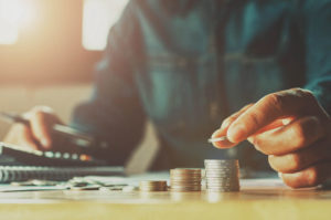 man counting coins