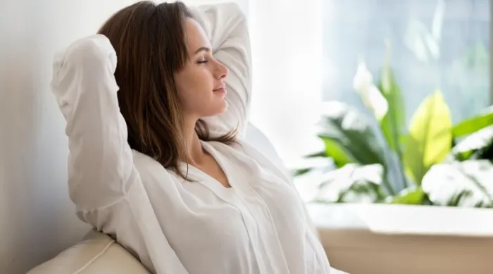 Woman Relaxing In Comfortable Home